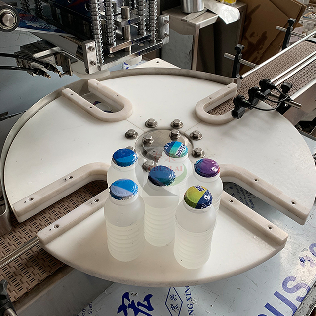 KIS-1800转盘式牛奶瓶铝箔膜封口机